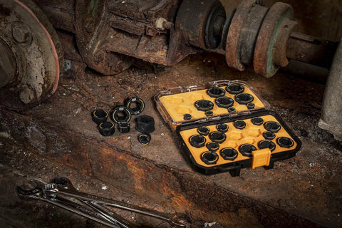 Bolt Biter Wrench Insert Set, 30-Piece SAE and Metric Kit displayed open on a rusty surface with visible sockets