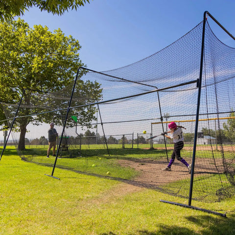 40 Foot Collapsible Batting Cage For Backyard Or Indoor Baseball And Softball Practice With A Heavy Duty Rust Resistant Steel Frame And UV Protected Net Black Frame Easy Setup Durable Year Round Hittin Cage in use
