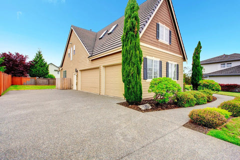 Heavy Duty Five Gallon Concrete Sealer With Water Based Siliconate Formula For No Sweat Salt And Water Repellency Against Cracking Pool Damage Tough As Nails Top Shelf Protection applied on a driveway.