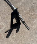 Close-up of Transfer Case Cable Shifter Kit For 231 Fits Wrangler TJ LJ 1997 2006 Easy Install on concrete surface.