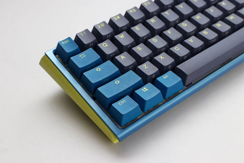 Kickass Sixty Percent Compact Mechanical Keyboard With Hot Swappable Top Tier Keys And Double Shot PBT Keycaps Dual Layer Sound Dampened Construction Plus Custom RGB Lighting For Daily Typing And Gaming Vibes That Totally Slam, angled view showing blue and gray keycaps.