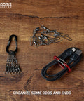 Two Inch Aluminum D Ring Carabiner Clips Pack Of Six Assorted Colors for organizing cables and keychains on wooden surface.
