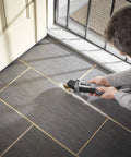 Person using Corded 120V 5 Amp Multi Max Oscillating Tool Kit With Accessories, Low Vibration For Pro Grade, Precise Cuts In Tight Spaces