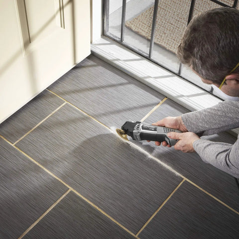 Person using Corded 120V 5 Amp Multi Max Oscillating Tool Kit With Accessories, Low Vibration For Pro Grade, Precise Cuts In Tight Spaces