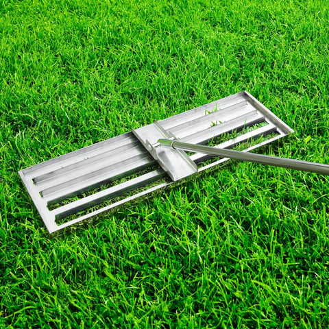 Stainless Steel 30 Inch Lawn Level Rake Pro Grade Yard Tool for even grass and smooth soil leveling with long handle in use on grass