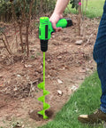 Person using Beast Of A Heavy Duty 3 Inch By 24 Inch Auger Drill Bit For High Torque Drills in a garden