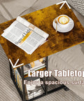 C Shaped Side Table With Charging Station And Wheels For Bedroom Living Room And Home Office Type C USB Ports And Two AC Outlets To Charge Up To Four Devices Plug And Play with a spacious tabletop holding a coffee cup and magazine