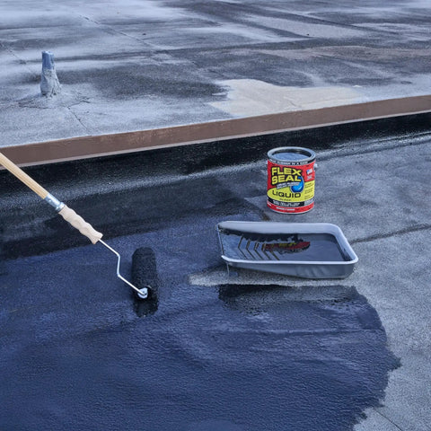 Applying Liquid Rubber Sealant Coating for Waterproof, Flexible, Breathable Protection That Resists UV on a roof with a roller