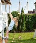 Child playing on Backyard Ninja Rope Bridge Ladder for Obstacle Course Training Includes 3 Delta Carabiners Perfect for Ninja Warrior Practice Kids Playset Basement Gym Dimensions 3.3 Ft By 5.9 Ft Hardwood Dowels outdoors