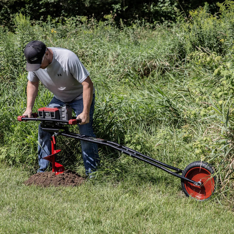 Man using 60V Cordless Dirt Auger With 8 Inch High Performance Bit, Spline Shaft, Carbide Blades, Variable Speed Trigger in grass