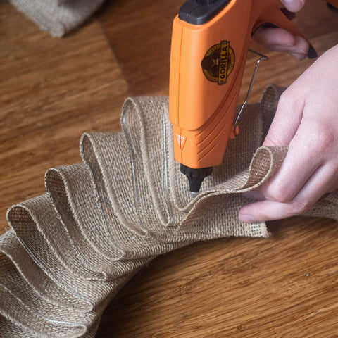 Using glue gun with clear mini hot glue sticks 4 inch long 0.27 inch diameter 75 count for all temperature glue guns on burlap
