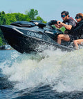 Two people jet skiing wearing Frameless Ultralight Black Mirror Swim Goggles With VisiClear Nanotech Anti Fog Lens And 100 Percent UV Protection for watersports.