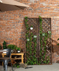 Wood Trellis Wall Hanging For Climbing Plants, Large Outdoor Garden Lattice Panels In Brown, Set Of Two against brick wall.