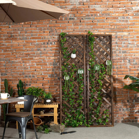Wood Trellis Wall Hanging For Climbing Plants, Large Outdoor Garden Lattice Panels In Brown, Set Of Two against brick wall.