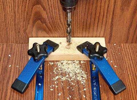Two 24 Inch Aluminum T Track Set With Hold Down Clamps For Woodworking installed, showing use on router table with blue anodized finish