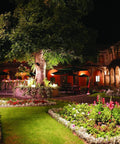 Night courtyard lit by Ultra Bright LED Bullet Flood Light 5000K Outdoor Exterior 10.5W 839 Lumen illuminating trees and walls