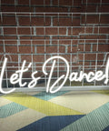 Lit Dance Neon Sign With Dimmer For Wall Decor Large LED Neon Light display with 'Let's Dance' text against brick wall background.