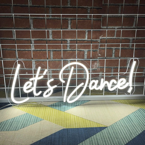 Dimmer Neon Sign For Wall Decor 21.3 By 17.3 Inch LED 3D Light In Cold White on brick background "Let's Dance!"