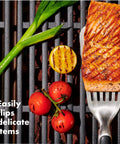 Grilling Tool Precision Turner For Effortless Burger Flips And Flaky Fish Fillets With Thin Beveled Head Non Slip Grip And Hanging Ring OXO Good Grips Black used on grill with fish fillet