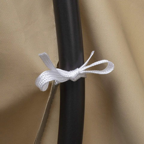 Close-up of Khaki Heavy Duty PVC Patio Loveseat Cover With Waterproof Backing Keeps Your Outdoor Sofa Dry Rain Or Shine Size 55 Inches Long By 33 Inches Wide By 38 Inches High Fits Most Standard Love Seats And Blocks Dust And Debris tied to a frame with a white strap.