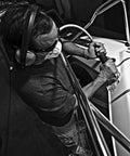 Worker using Reciprocating Air Saw For Pros On The Job With Ten Thousand SPM And Three Eighths Inch Stroke Front Exhaust