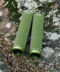Holeshot Lock On Mountain Bike Grips With 22mm Inner Diameter in Olive Green on mossy rock background