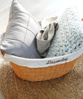 Rattan Laundry Basket With Easy Carry Handles And Removable White Cotton Liner, Natural Wicker Hamper with pillows and blanket.