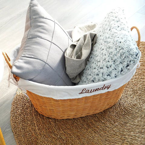 Rattan Laundry Basket With Easy Carry Handles And Removable White Cotton Liner, Natural Wicker Hamper with pillows and blanket.