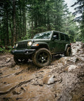 Jeep with Trail Blade MTS Mud Terrain Radial Tire For Light Trucks And Jeeps, 35X13.50R24LT navigating mud terrain
