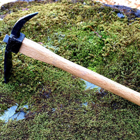 Beast Of A Heavy Duty Japanese Hand Forged Steel Pick Axe For Digging And Weeding Gardens 14-3/4 Inch Mattock Tool on moss