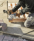 Using the Rock Solid Heavy Lifter 20V Compact Circular Saw Kit for precise wood cutting with a depth guide on a worksite.