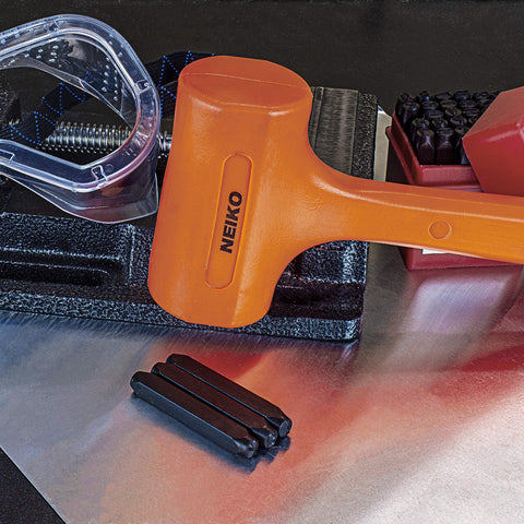 2 Pound Neon Orange Dead Blow Hammer With Unibody Molded Handle And Checkered Grip For Maximum Impact, Steel Shot Filled Head Prevents Sparks And Rebound, on metal surface