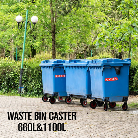 Blue waste bins with wheels outdoors on pavement next to green trees and lanterns.