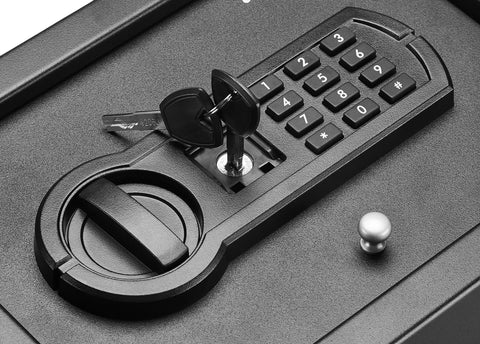 Close-up of Slim Desk Drawer Safe With Programmable Electronic Keypad For Quick Access, showing keypad and keys on black safe surface.