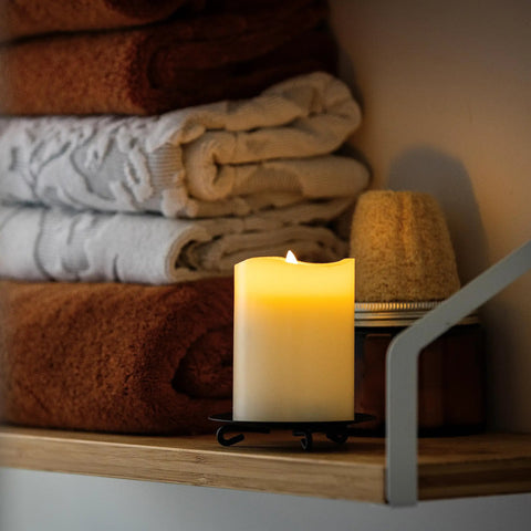 Six Count Real White Wax Flameless LED Pillar Candles 3 By 4 Inches With Remote And Timer Dimmable Flicker Battery Powered on shelf