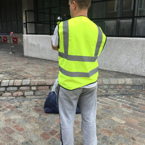 Person wearing Must Have High Visibility Reflective Safety Vest 10 Pack Neon Yellow Gear For Outdoor Work And Play