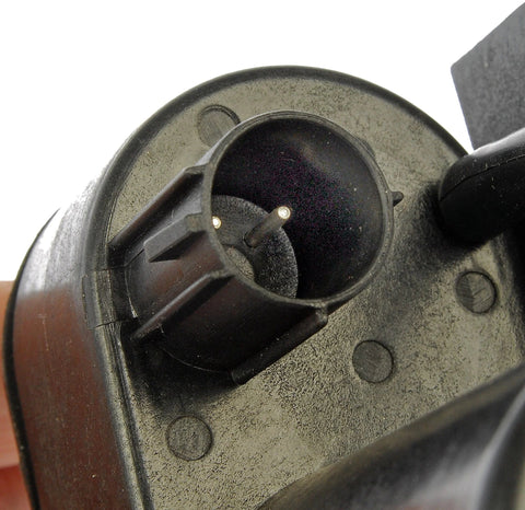 Automotive vacuum pump, black plastic housing, round intake port with two pins, top view