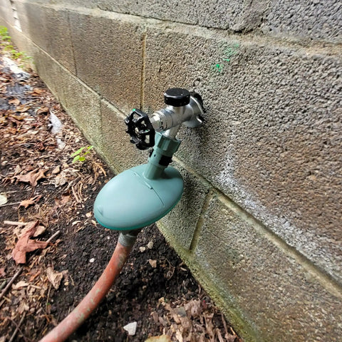 Easy To Use No Fuss Hose End Irrigation Timer With Large LCD Digital Display attached to wall faucet