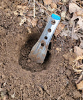 Ultralight Backpacking Trowel 0.48 Oz 13.5 G Blue With Lifetime Warranty Made In USA digging in soil outdoors.