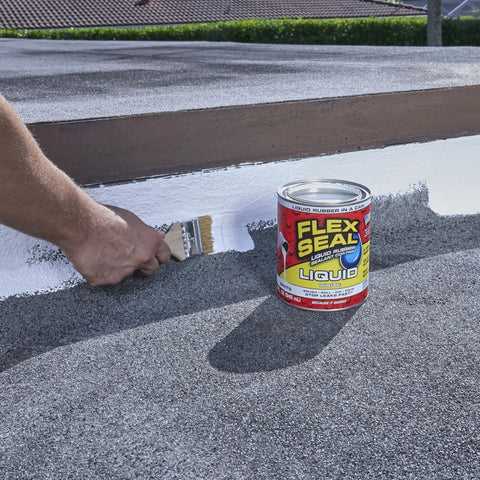Liquid Rubber Coating Sealant For Waterproof Flexible UV Resistant Protection On Roofs Basements RVs Campers Trailers Marine Surfaces EPDM Masonry 32 Oz Easy To Apply No Mess DIY Friendly No Brainer being applied with a brush on a rooftop surface