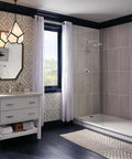 Modern bathroom with chrome fixtures, white vanity, geometric wallpaper, and glass shower; Modern One Handle Project Pack Chrome Faucet With Rigid Spout WaterSense Labeled ADA Compliant Fits Single Hole Installations Durable Metal Build Easy Install Low Flow Design For Big Water Savings.