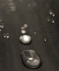 Close-up of waterproof and dustproof hydrophobic prefilter mesh for air filters 18 by 18 inch fabric with water droplets