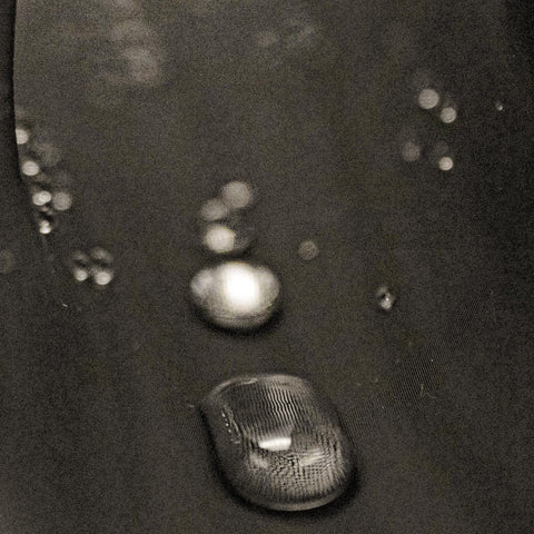 Close-up of waterproof and dustproof hydrophobic prefilter mesh for air filters 18 by 18 inch fabric with water droplets