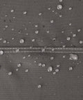 Close-up of water droplets on Ravenna Water Resistant 58 Inch Patio Sofa Loveseat Cover Small Taupe Outdoor Furniture Cover