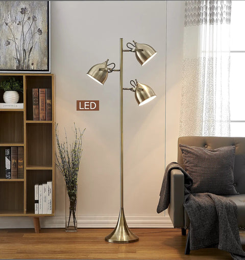 Caprice LED Floor Lamp In Antique Satin Brass With Three 360 Degree View LED Bulbs in living room setting