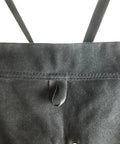 Close-up of Deluxe Waxed Canvas Tool Apron showing crossback straps and grommets, ideal for all-day comfort.