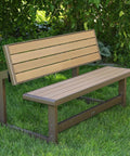 Convertible Bench To Table In Seconds Outdoor Furniture With Faux Wood Look No Fuss One Person Setup in bench form on grass.
