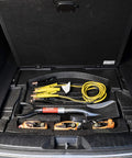 Compact Mini D Handle Square Head Shovel With Soft Grip, stored in car trunk with jumper cables, red and black finish.