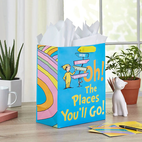 13 Inch Large Dr. Seuss Graduation Gift Bag With Tissue Paper And Card Oh The Places You'll Go For High School College Kindergarten Nursing School Grads on table