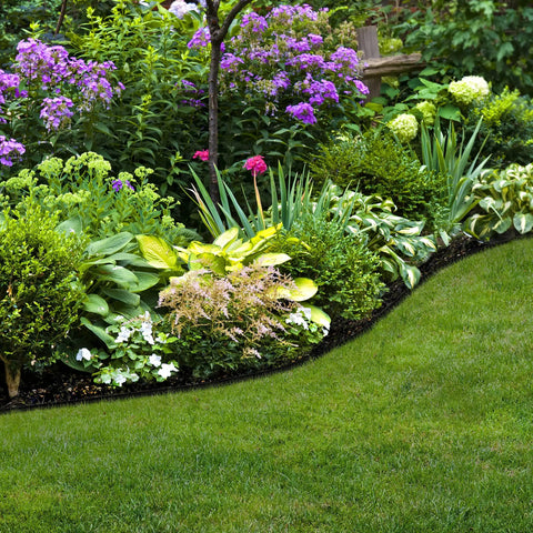 Pound-In Lawn Edging With Bonus Anchoring Stakes for Easy DIY Landscape Border, 4.5 Inch Straight-Top Plastic Garden Border Kit, 20 Foot Black, installed around garden beds